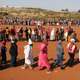 People stand in a queue to receive food aid in Pretoria.